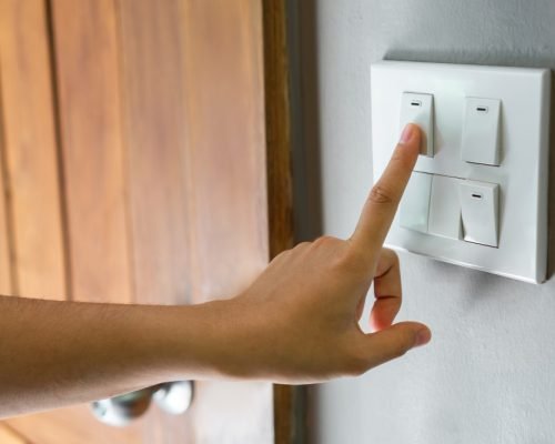 female-finger-is-turning-off-lighting-switch